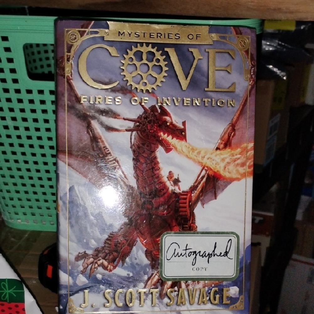 Mysteries of Cove: Fires of Invention by - Gold and Red Cover